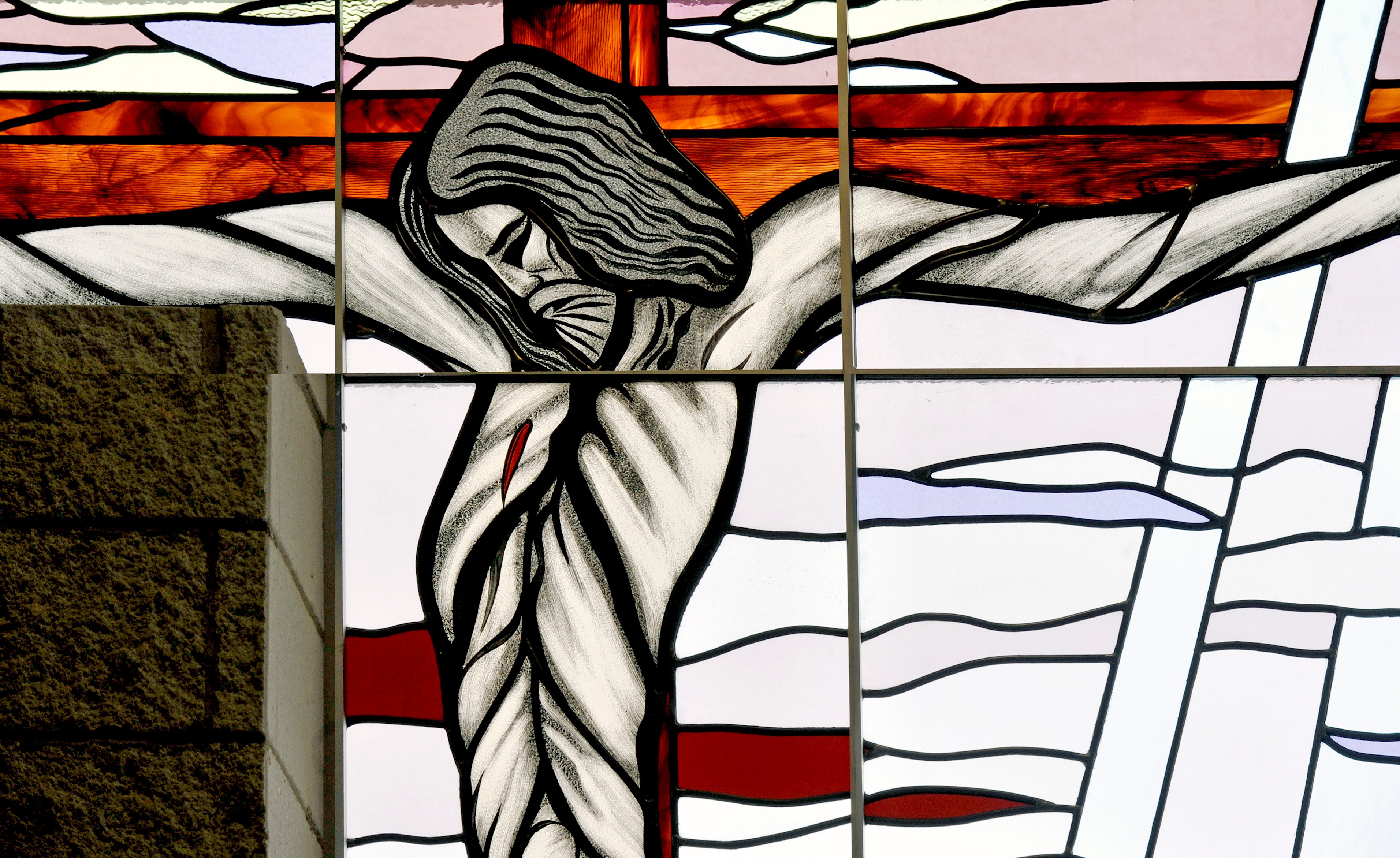 Stained glass window of Jesus on the cross