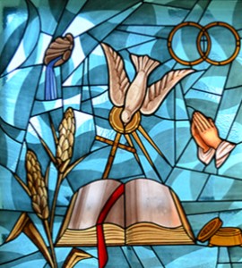 stained glass window style image of Holy Spirit dove flying down into a bible