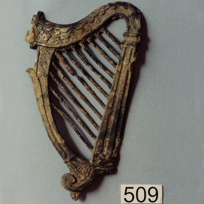 Metal coffin decoration with an Irish harp