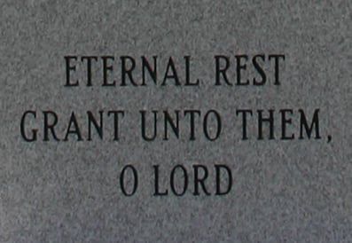Memorial monument inscription reading "Eternal Rest Grant Unto Them, O Lord"