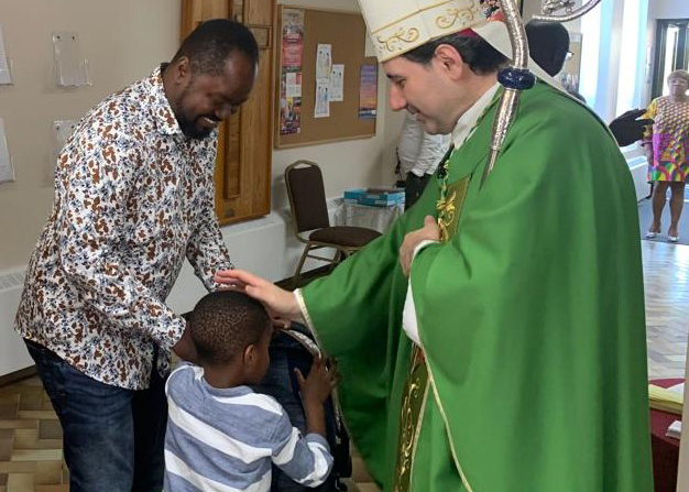 Archbishop Leo greats the faithful