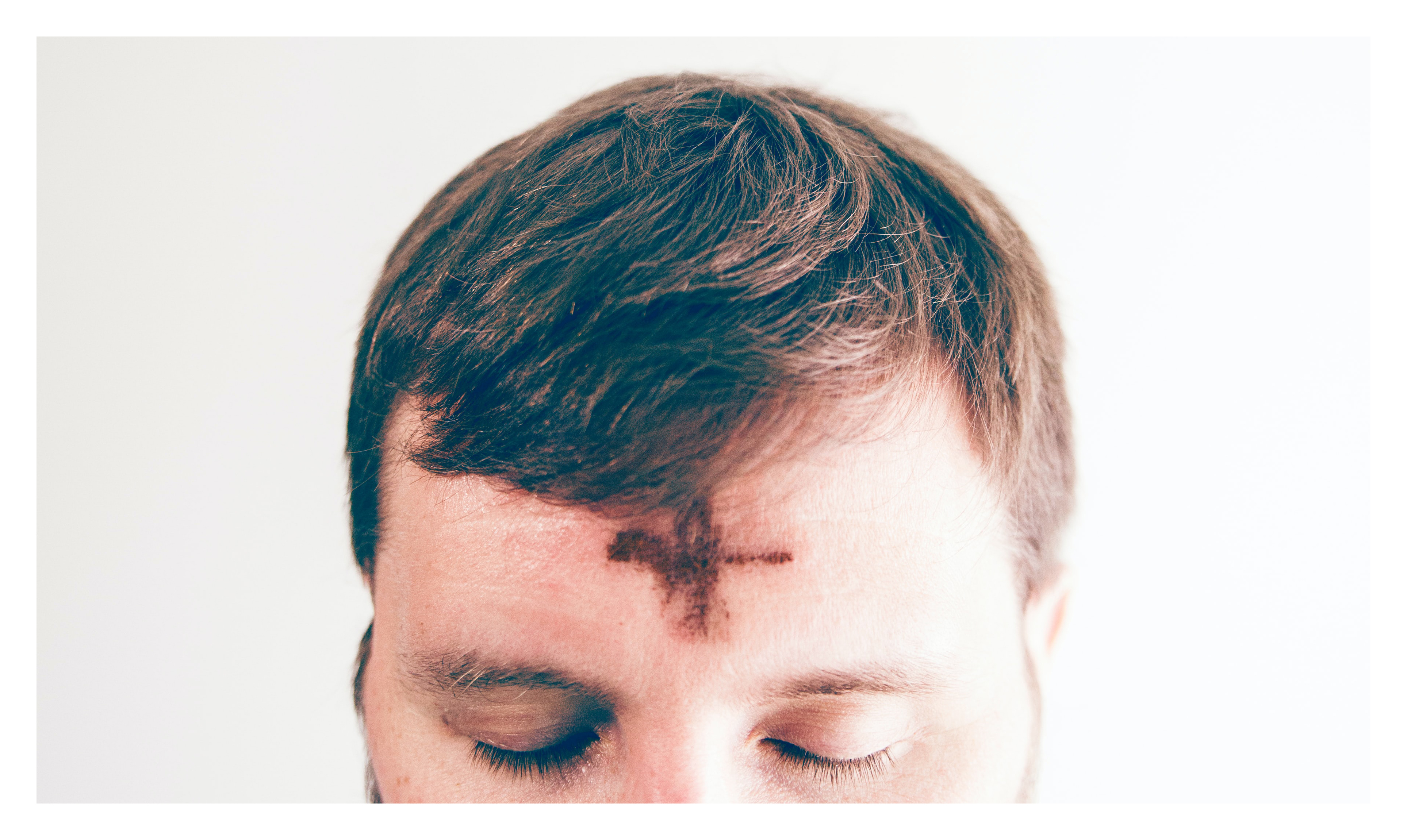 Photo of a man with ashes on