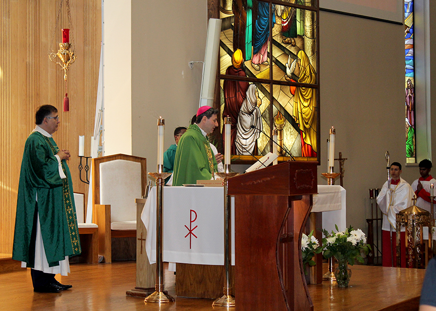 Archbishop Leo standing at the altar