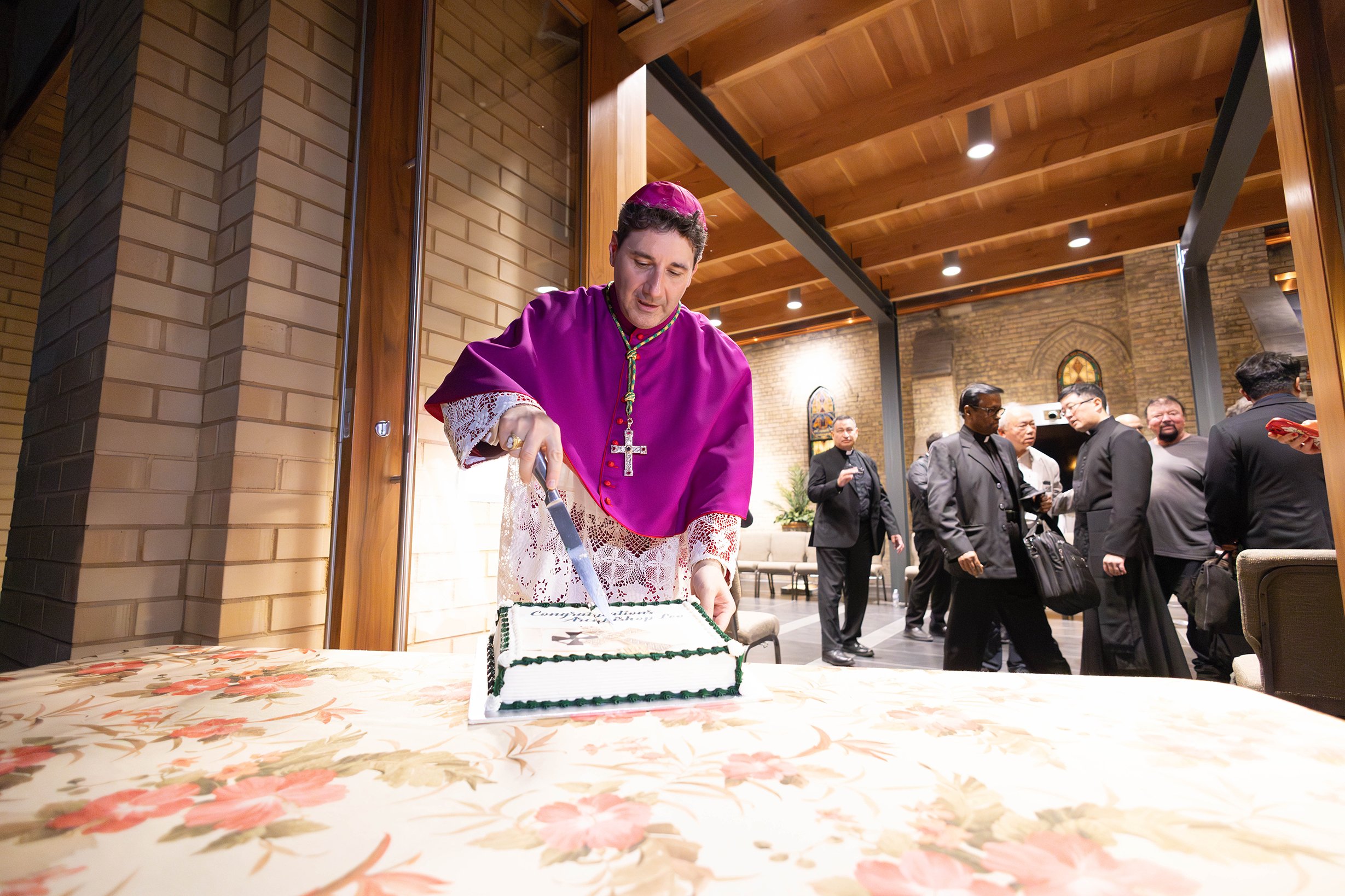 Archbishop Leo Cuts Cake