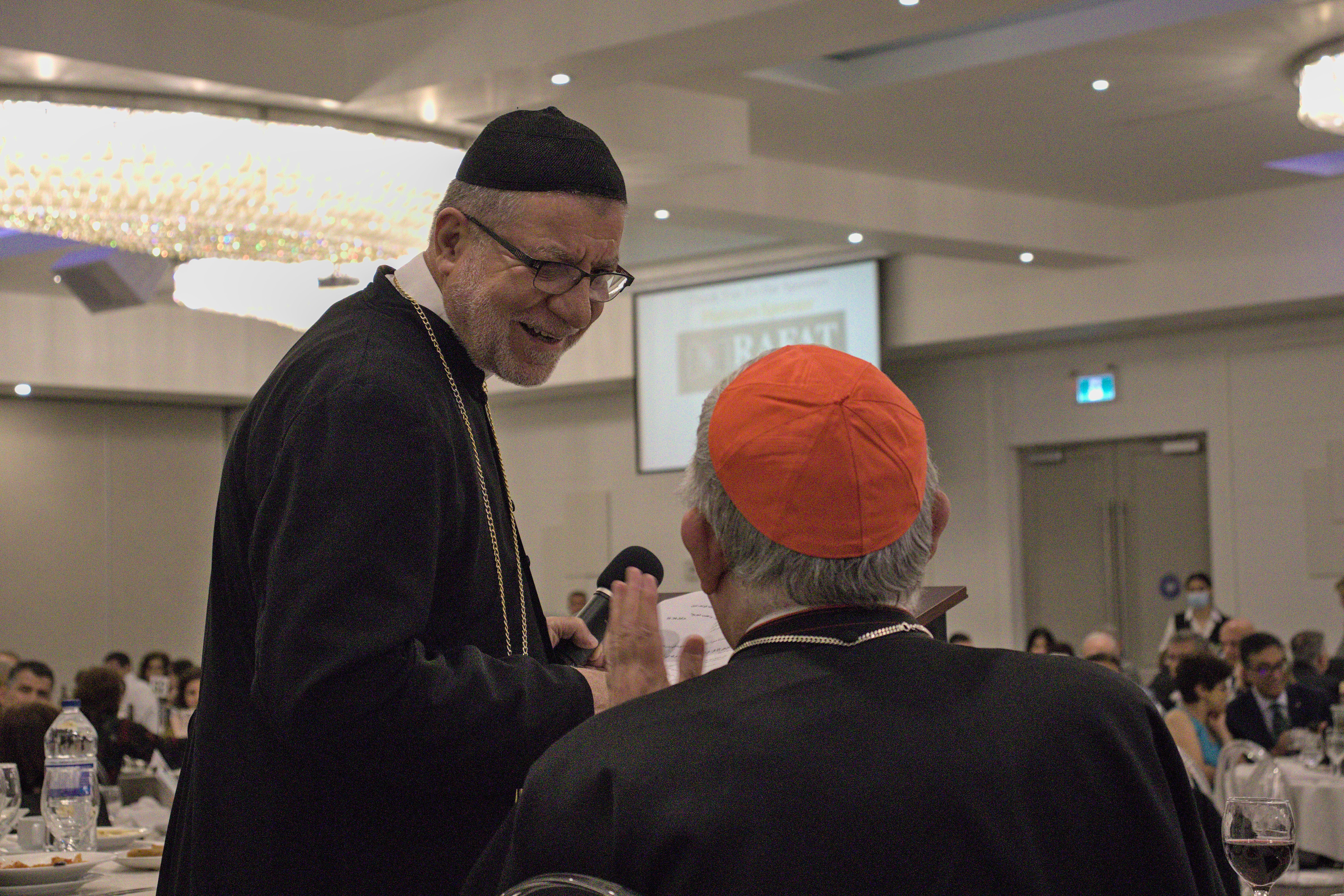 A speaker joyfully looking at the Cardinal