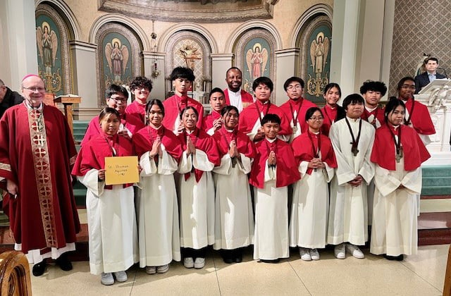 Bishop Kasun with altar servers from St. Thomas Aquinas Parish