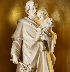 A statue of St. Joseph holding the child Jesus
