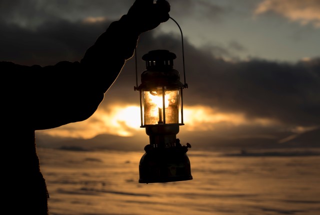 Person holding lantern