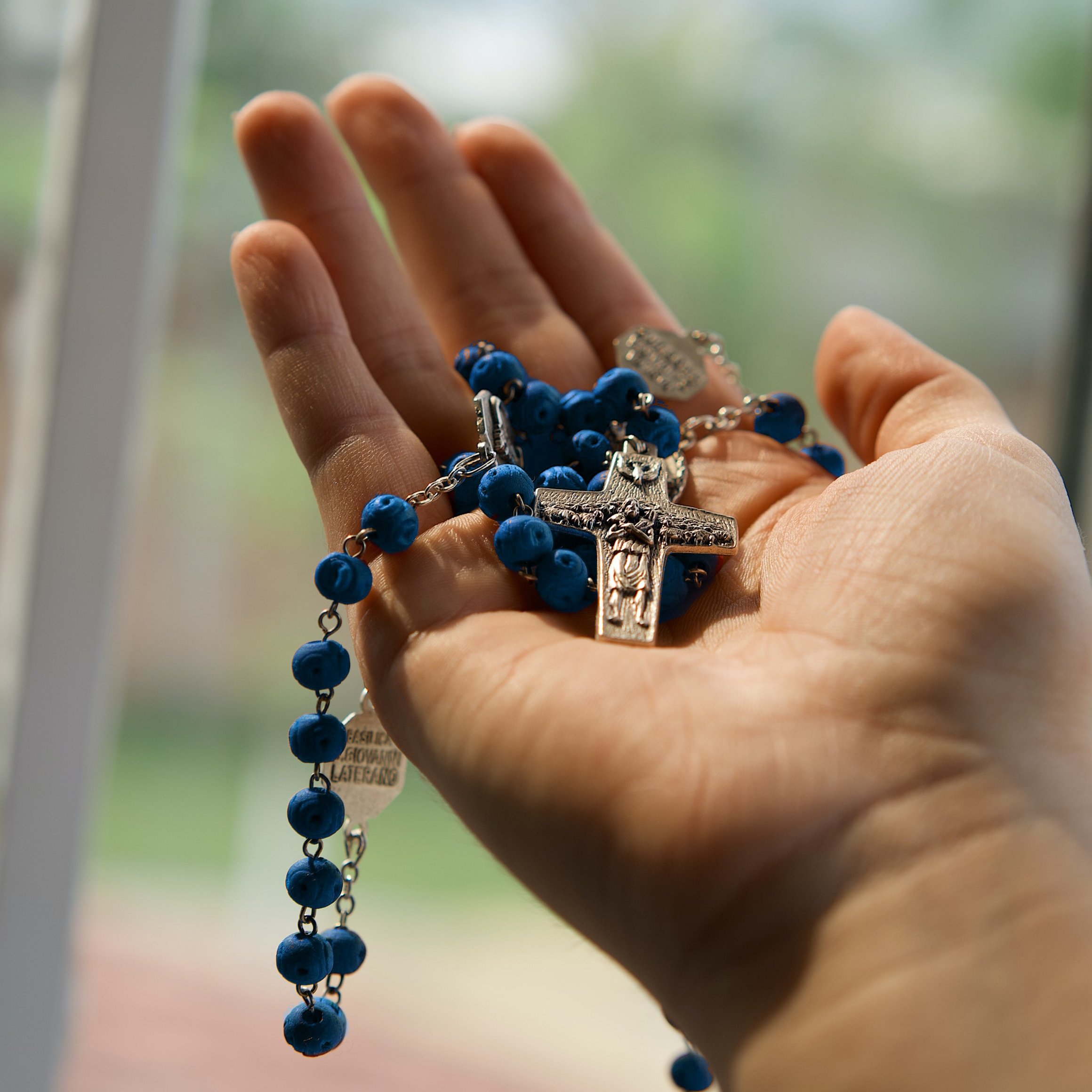 Hand Open Holding Rosary