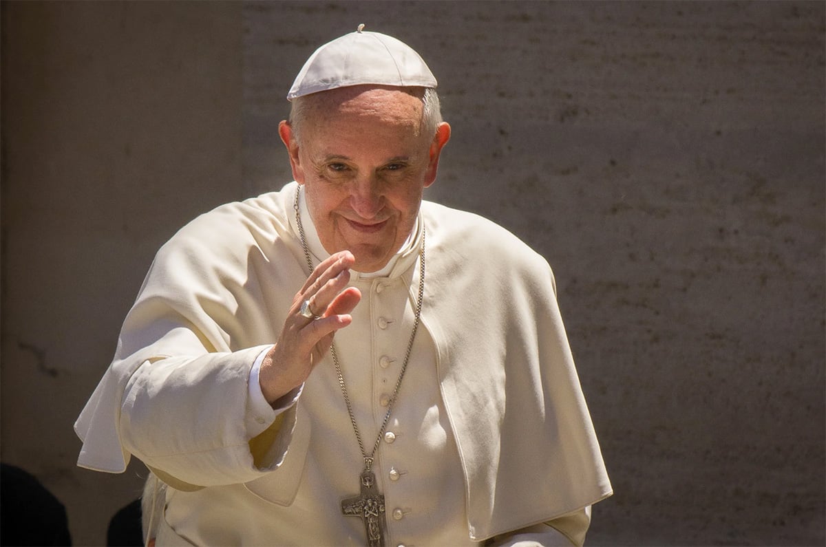 Pope Francis smiling and waving