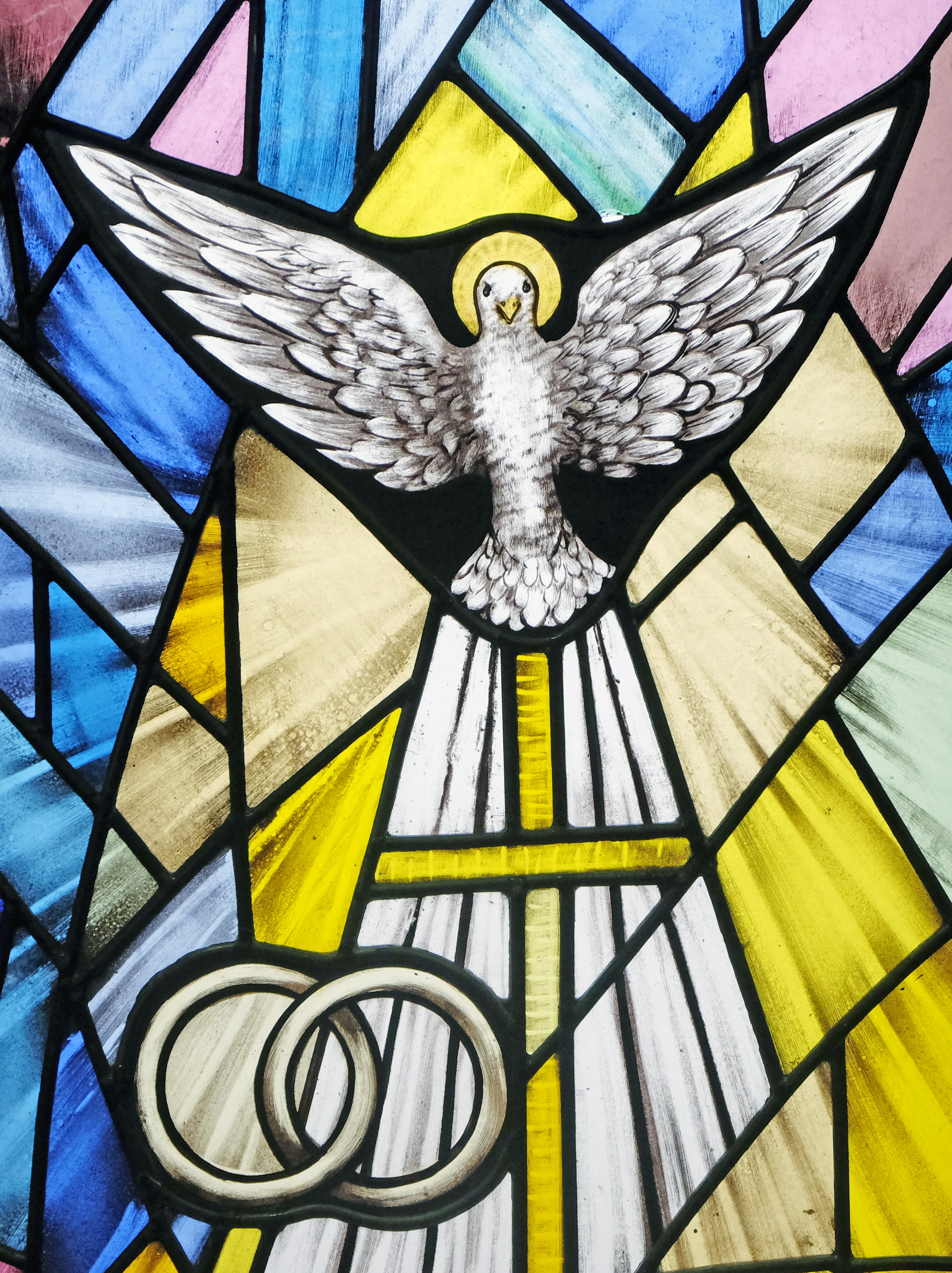 Stained glass windows with dove and rings