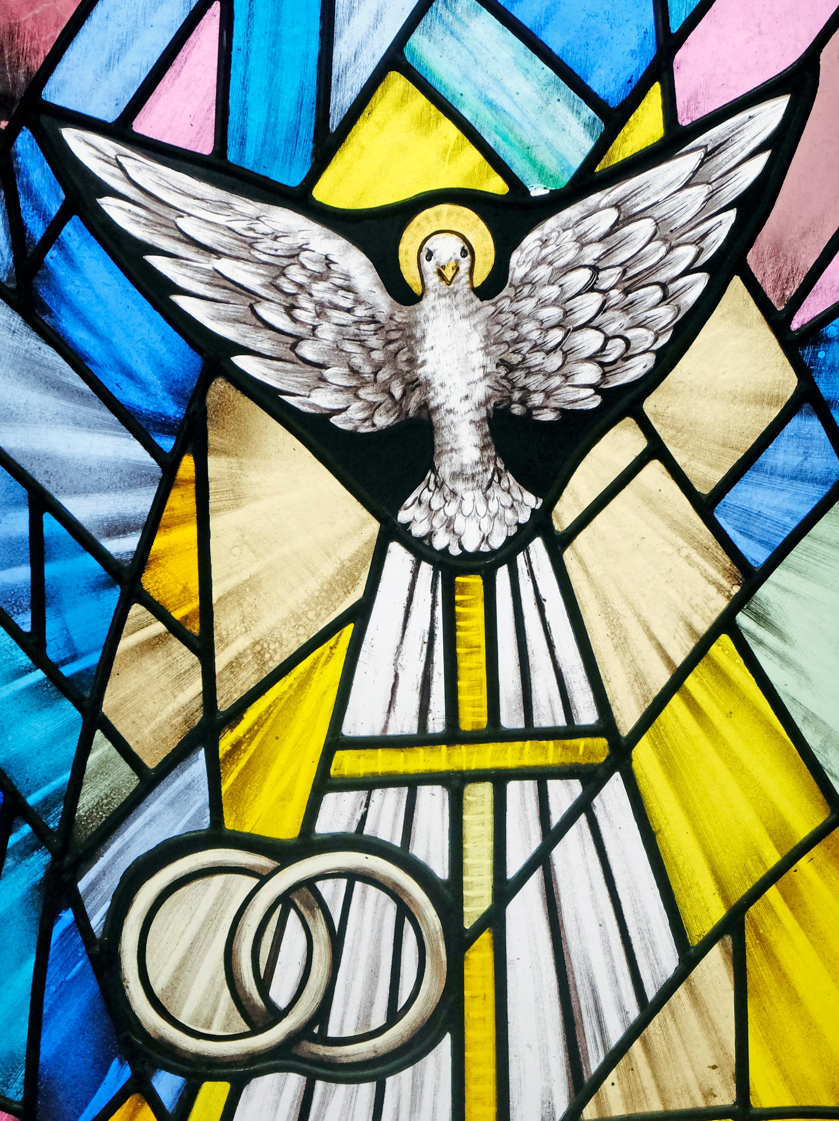 Stained glass windows with dove and rings