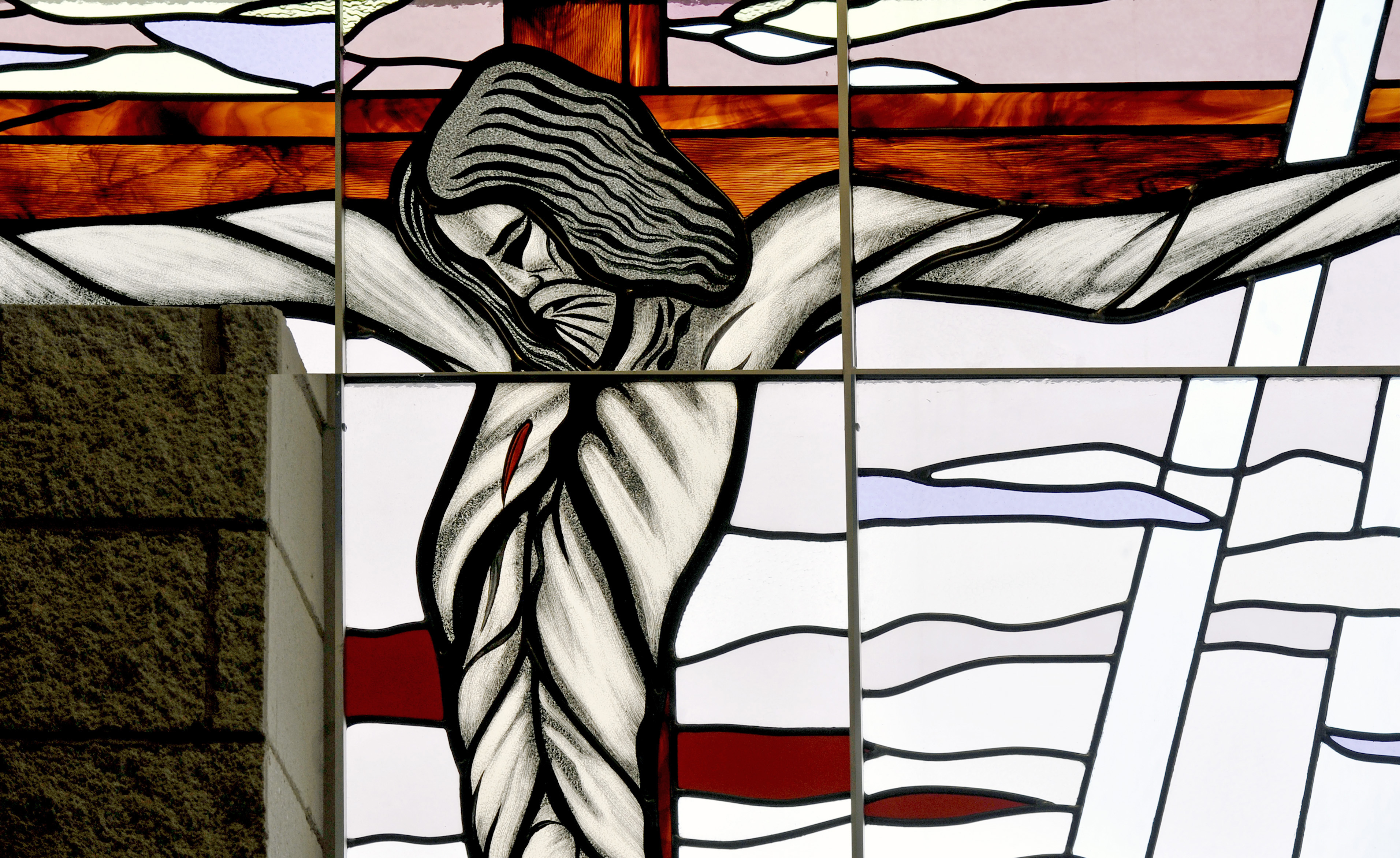 Stained glass window of Jesus on the cross