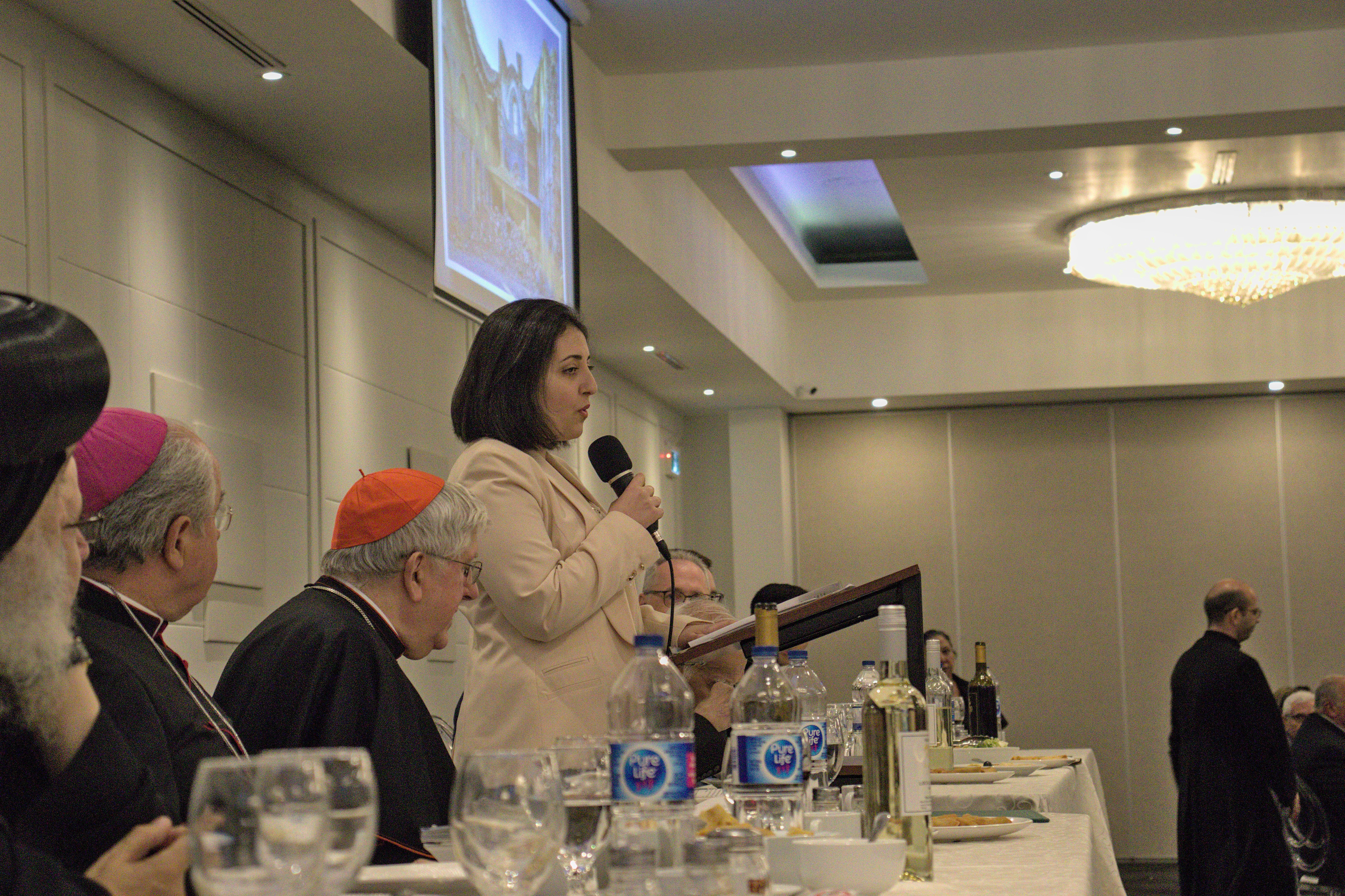 Photo of a person speaking at a podium