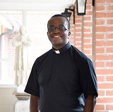 A photo of Fr. Charles Kelechi Egbulefu in the halls of St. Augustine's Seminary