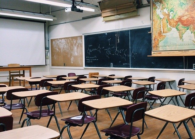Empty classroom with school chairs