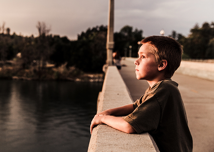 Boy on a bridge