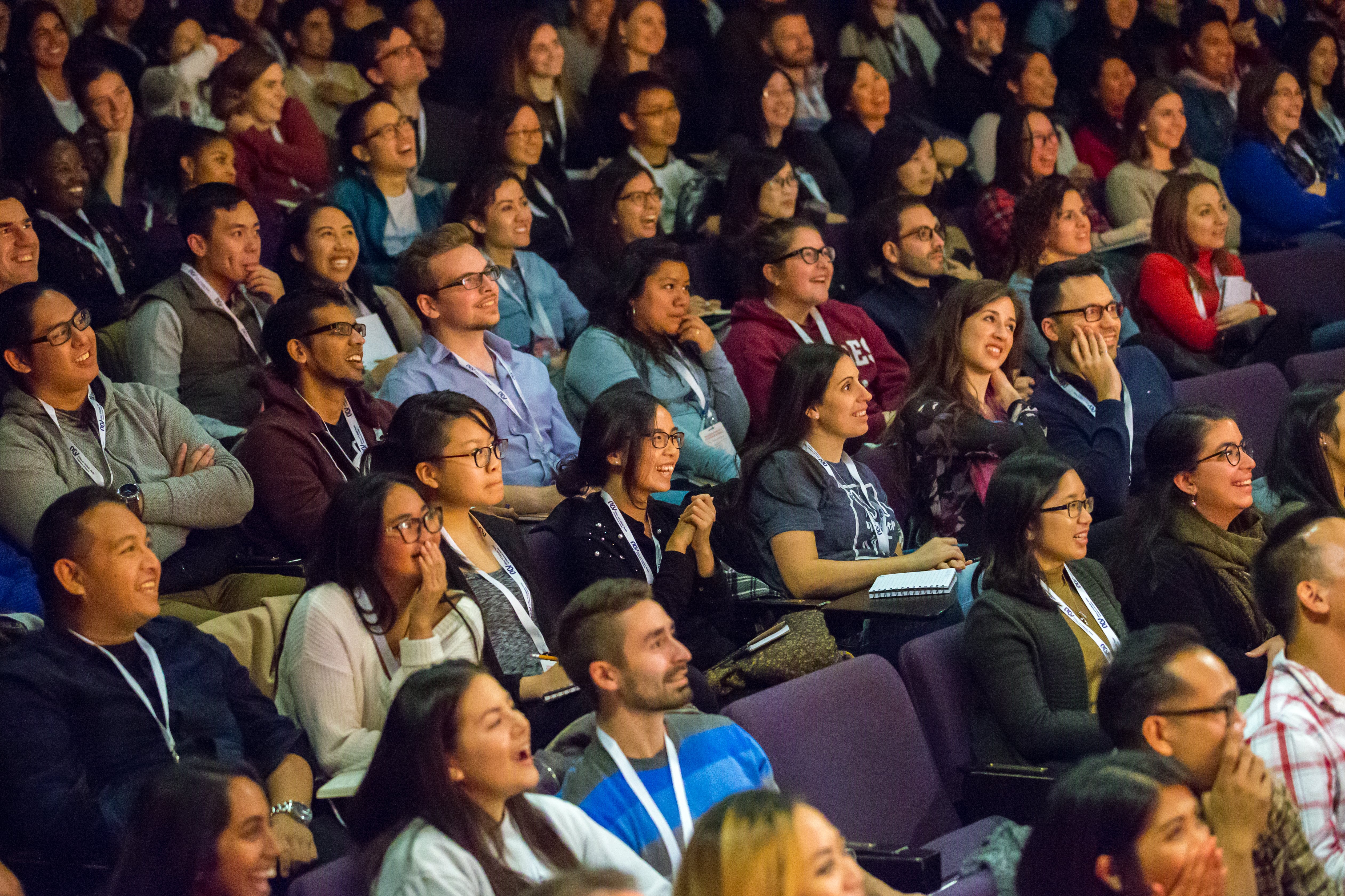 Laughing young adults during conference