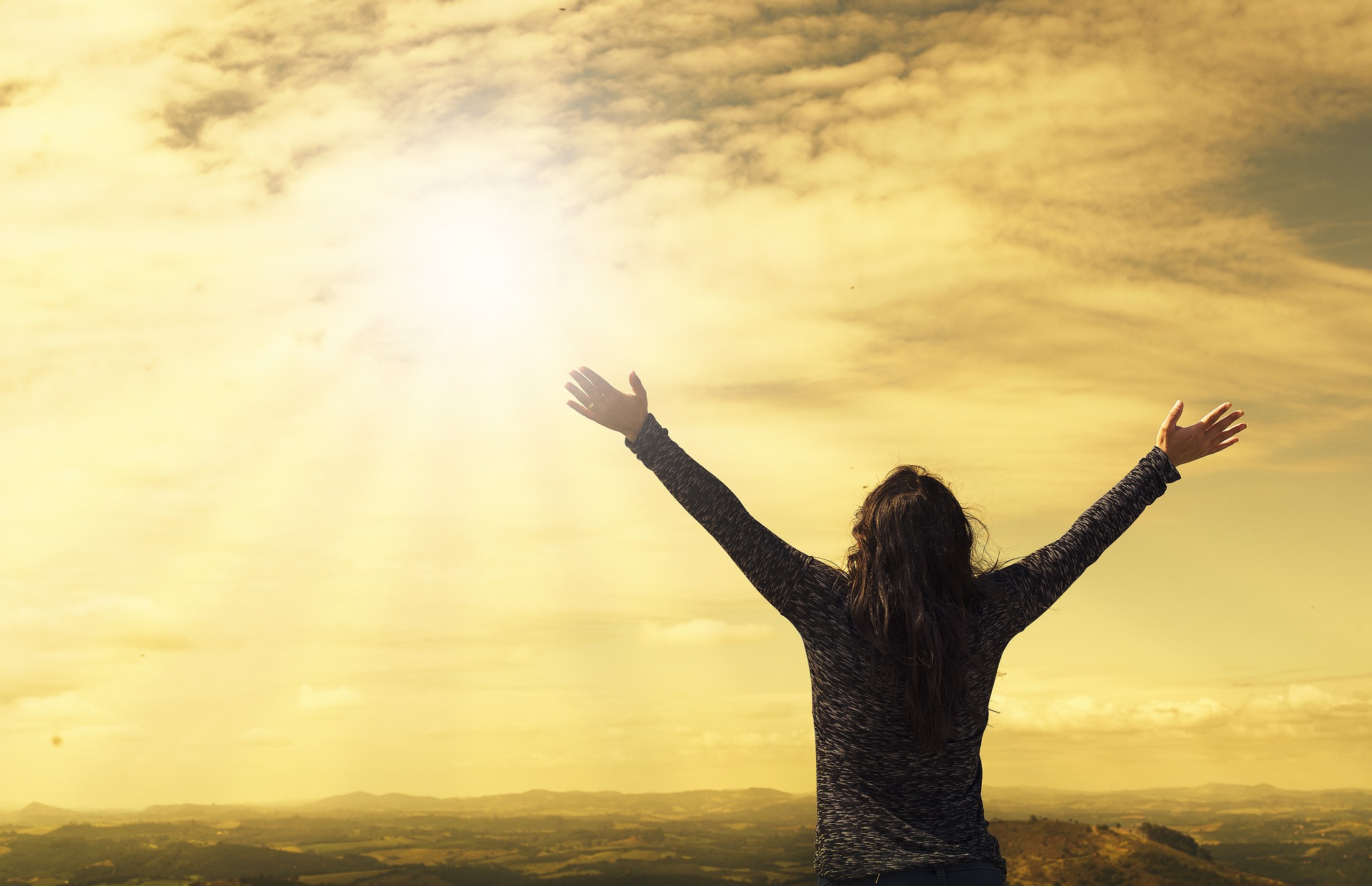 Woman with arms stretched out