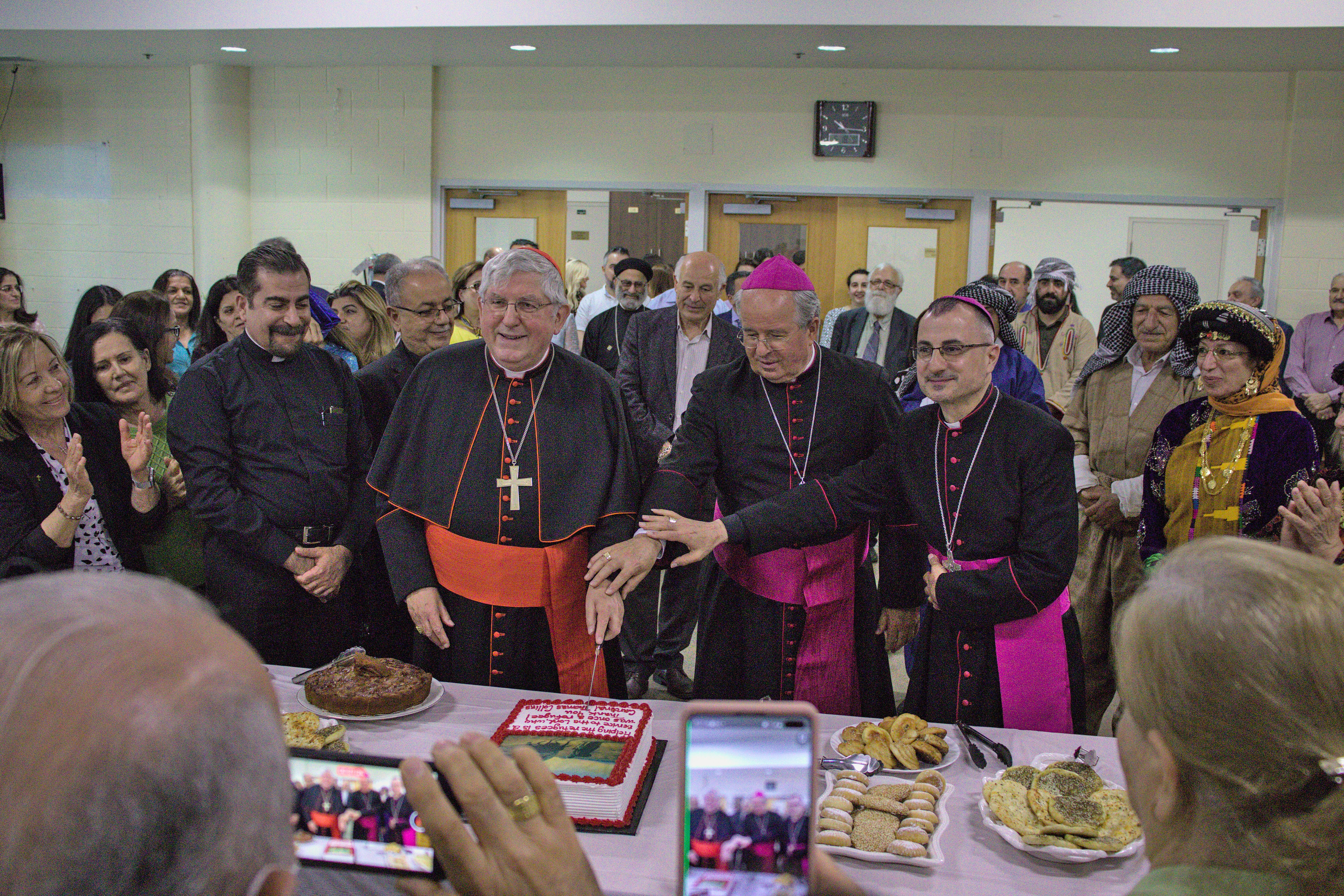 Photo of the Cardinal cutting a cake