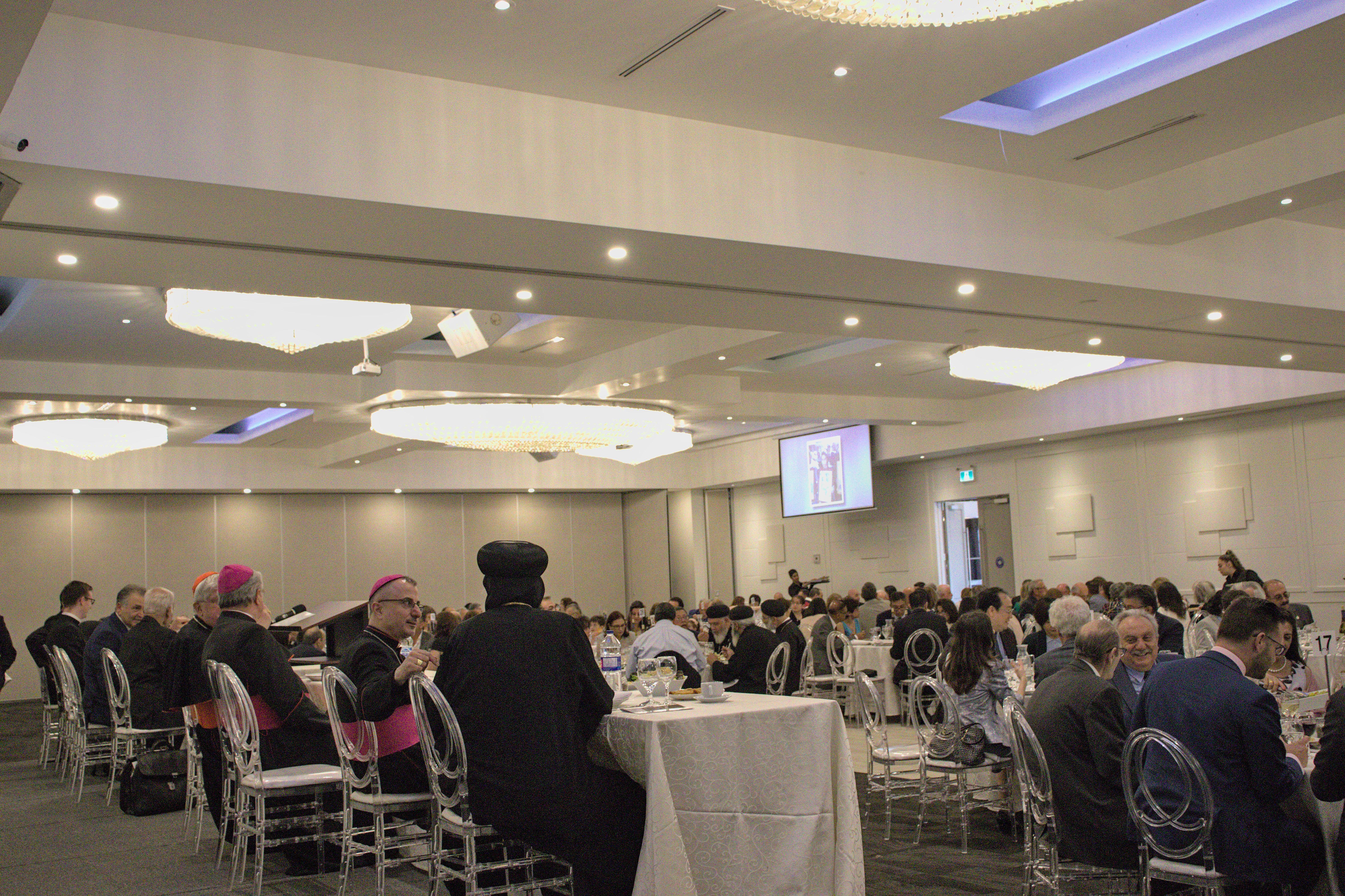 Photo inside a banquet hall full of guests