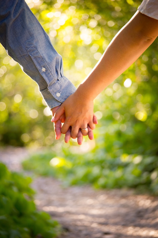 Couple holding hands outside