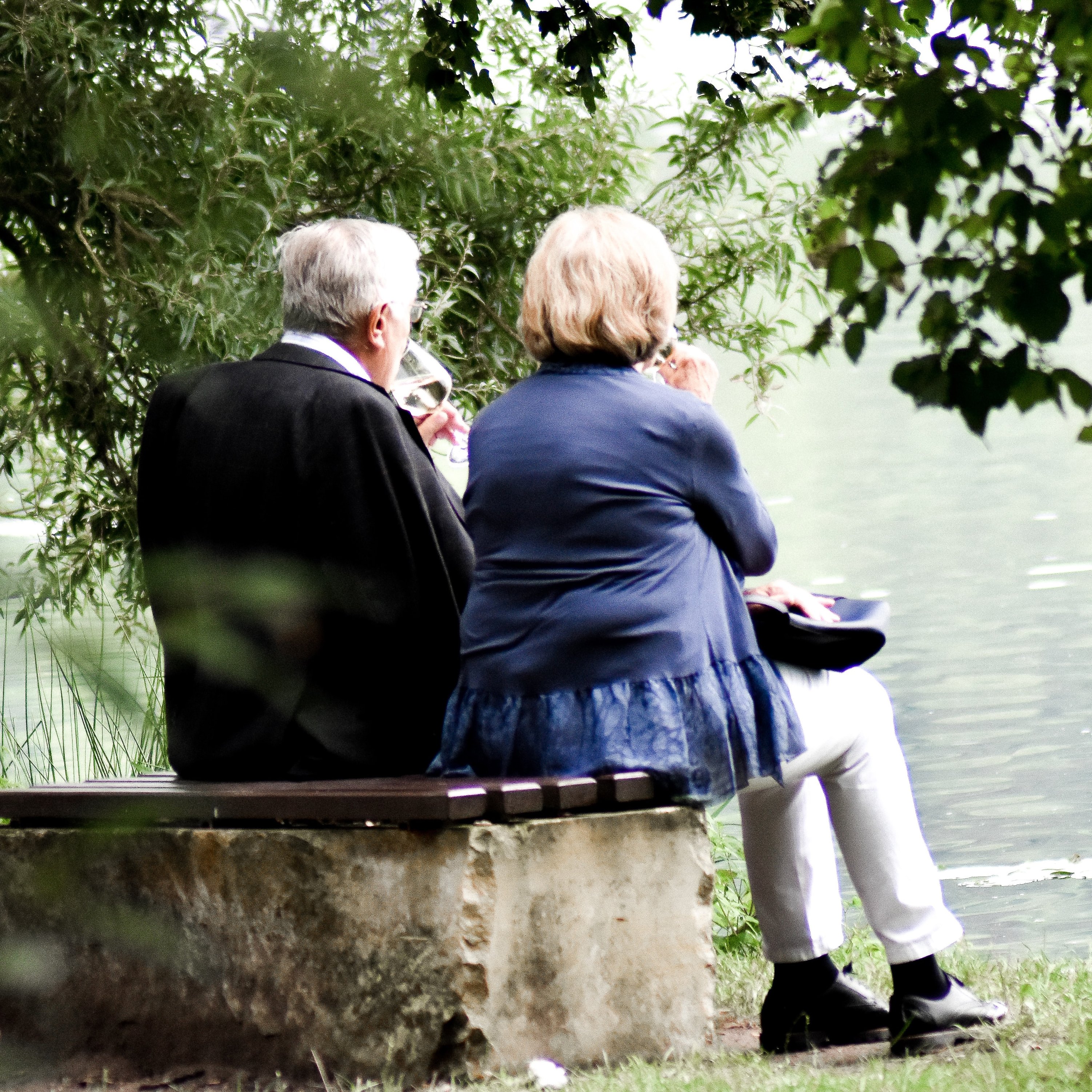 Elderly Couple Sitting on Bench