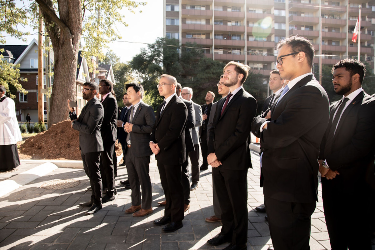 Seminarians standing outside Serra House