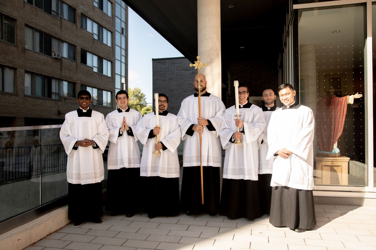 Seminarians standing outside Serra House