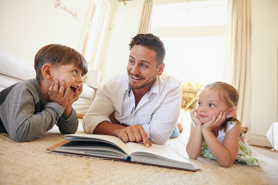 Father reading with children