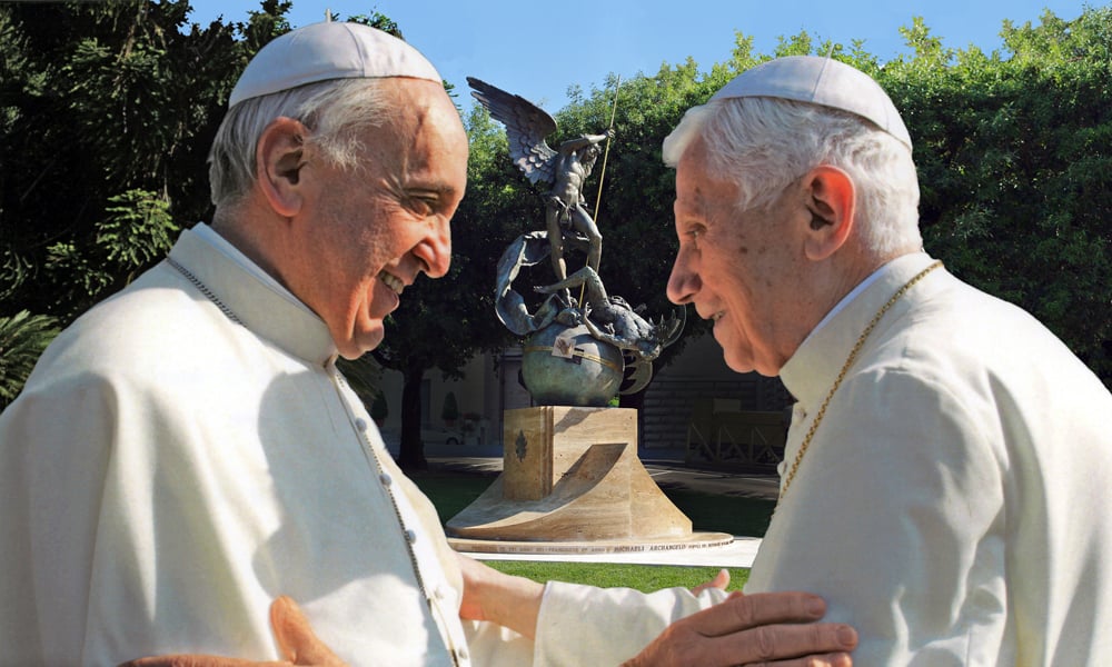 Pope Francis and Pope Emeritus Benedict XVI in Conversation with a Statue of St. Michael in the Background