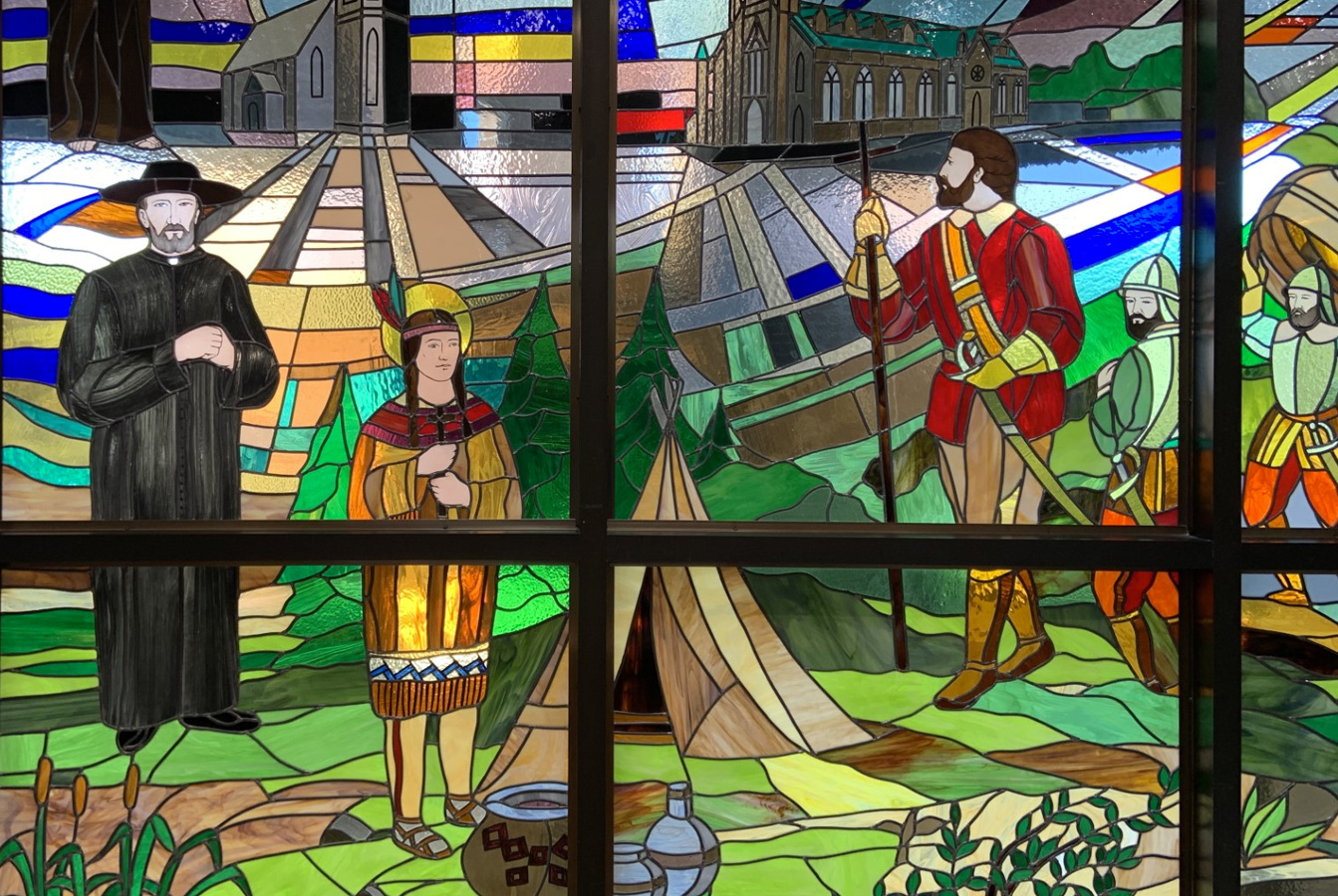 Stained glass window with Indigenous scene