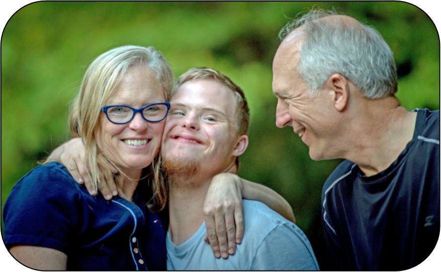 mother, son, and father embracing each other