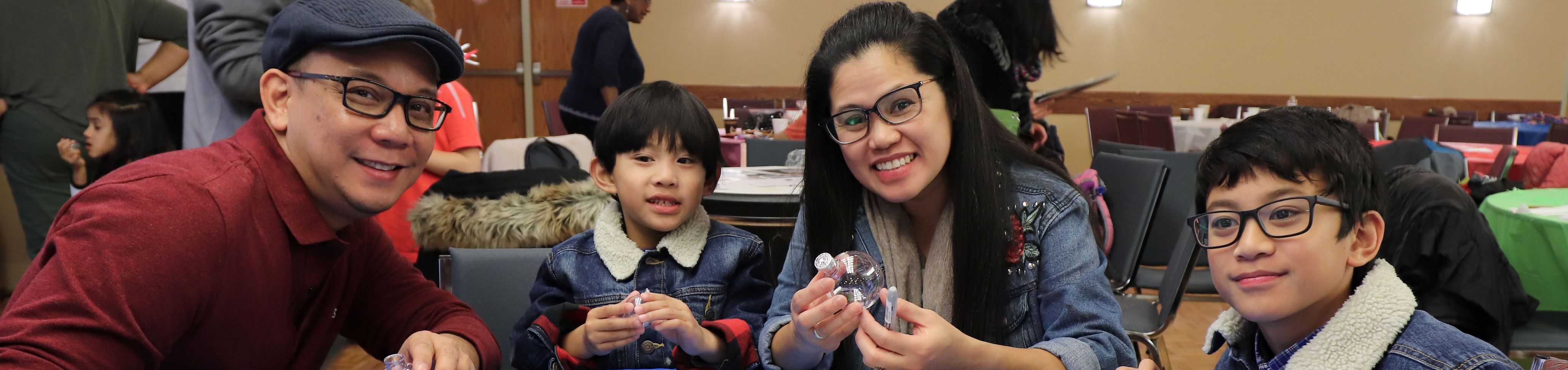 Father, mother, and two songs participating at our Family at the Heart of Service event in 2018