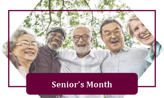 a group of older men and women with arms locked smiling