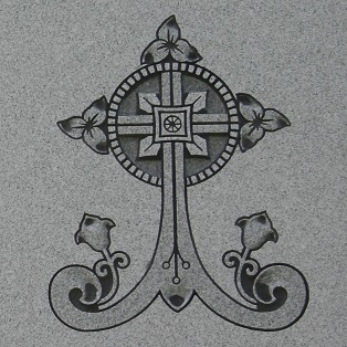 Memorial monument inscription of a circled cross with trillium flowers