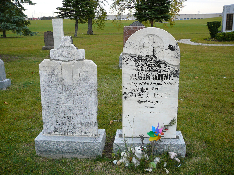 Closeup of restored light stone grave markers