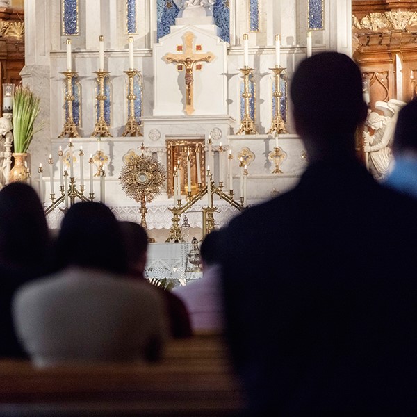 People worshipping at a Catholic Church